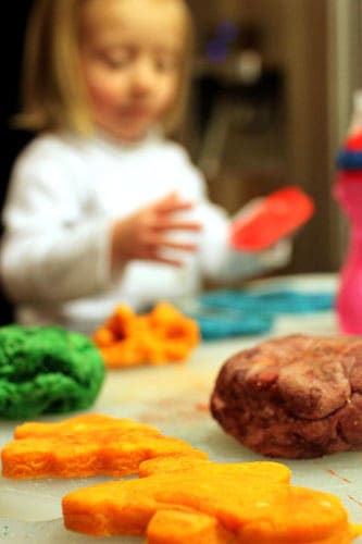 Girl playing with homemade playdough
