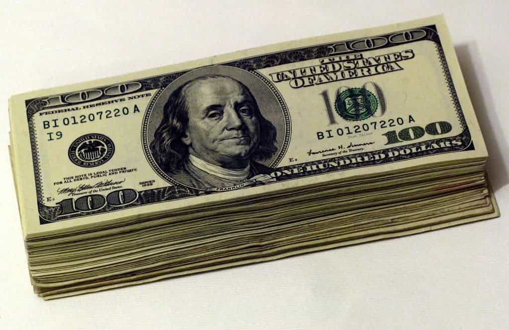 Pile of Ben Franklin 100 dollar bills