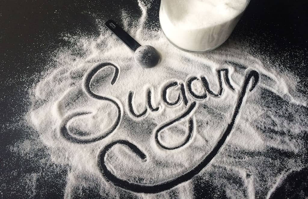 Sugar written in script. The impact of sugar on kids