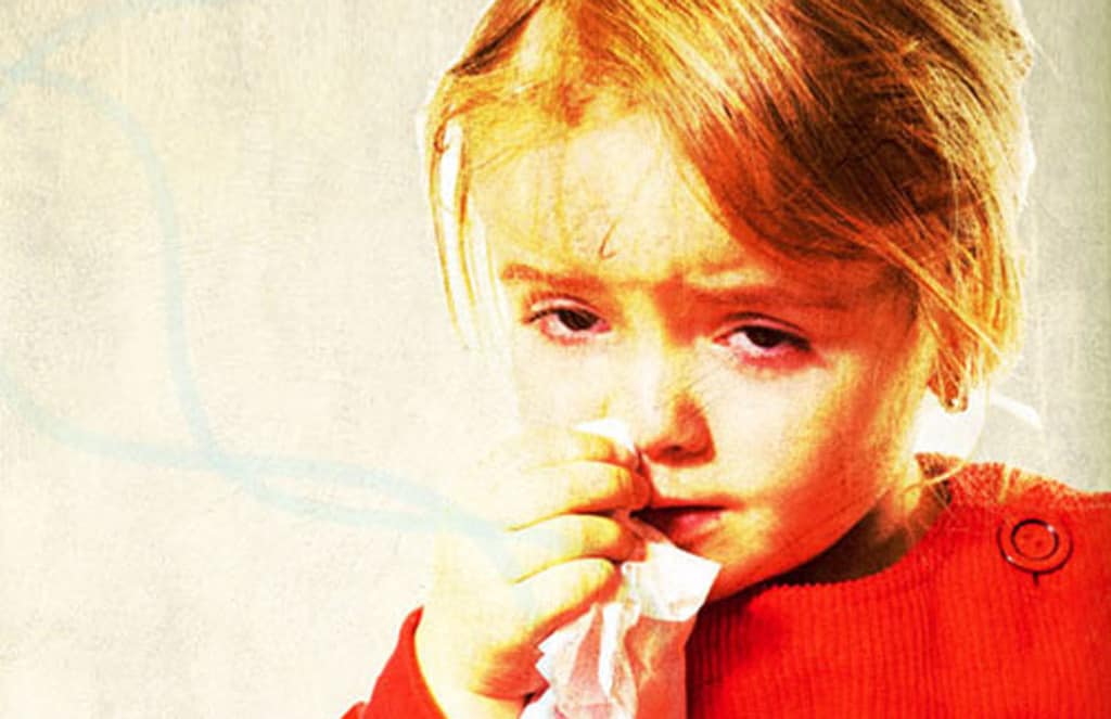 Little Girl with runny nose and red watery eyes