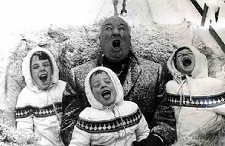 Family singing in snow on sleigh ride